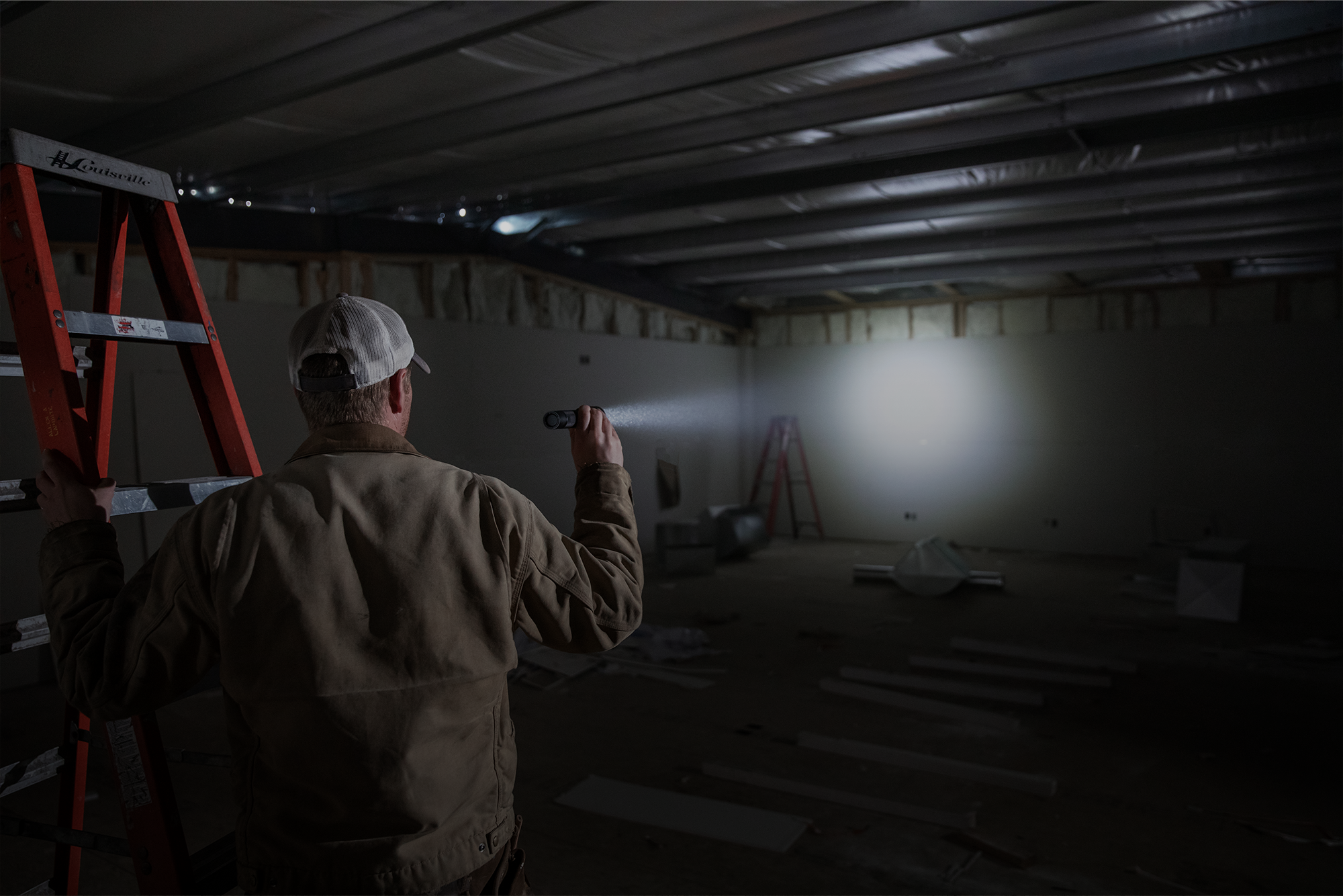 Banner with text, new arrivals, reliable options for power and lighting featuring a man working indoors. Shop now.