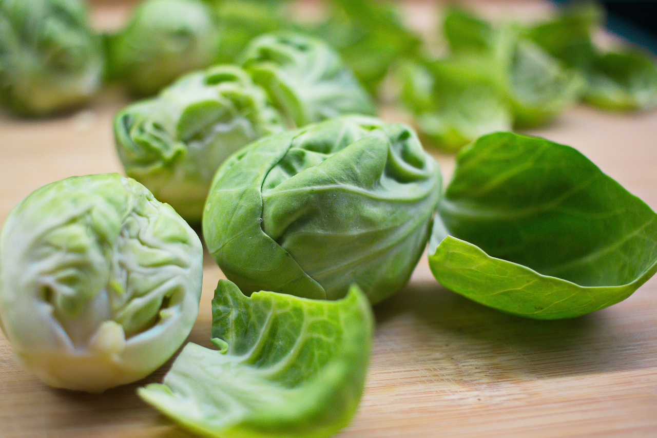 Image of Brussels sprouts on a wooden table.