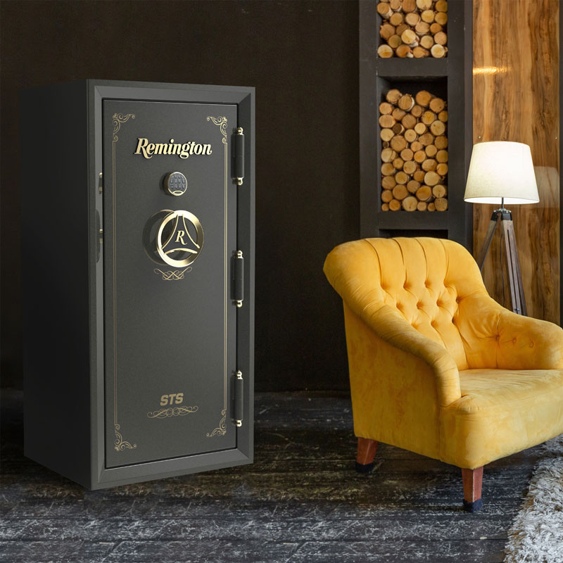 Black Remington gun safe with gold accents in living room next to yellow sitting chair, lamp and stacks of firewood